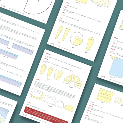 Several instruction sheets with diagrams and step-by-step text are arranged on a green surface, illustrating folding and cutting techniques for making the Sunrise Wall Hanging Downloadable PDF Quilt Pattern.