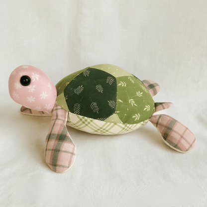 Tom the Turtle Quilt is a downloadable PDF quilt pattern featuring a green patchwork turtle design inspired by turtle quilts, perfect for creating your own unique quilt project.