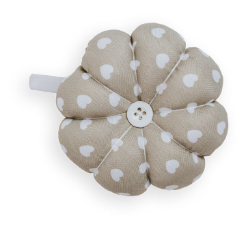 The 8 Free Digital Pattern Bundle features a beige fabric flower-shaped pincushion with white heart designs and a central button.